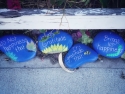 Whimsical painted rocks say: It's not happiness that brings gratitude; it's gratitude that brings us happiness.