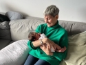 Lynne McTaggart holding her baby grand daughter
